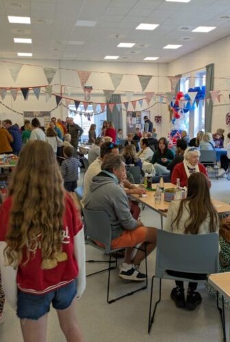 A crowd of party guests at the VE Day 80 celebrations.