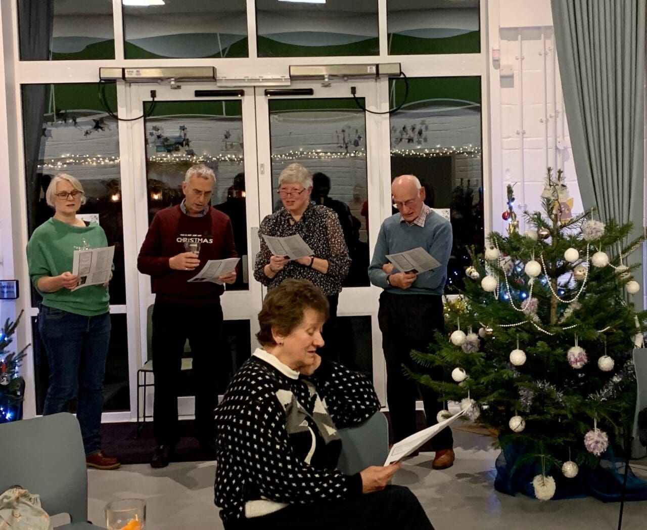 Carols round the tree.