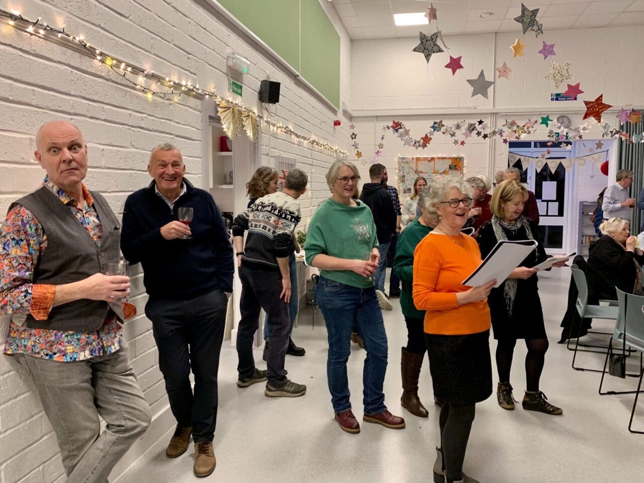 Partygoers sing along to the carols.